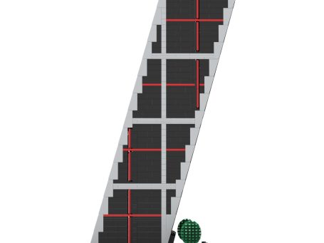 Edificio con fachada negra y líneas rojas, con unas figuras verdes en la base.