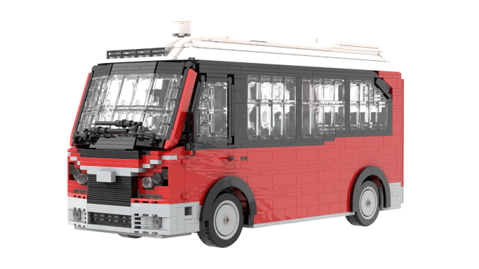Autobús rojo con detalles en blanco y ventanas oscuras, modelo de juguete.