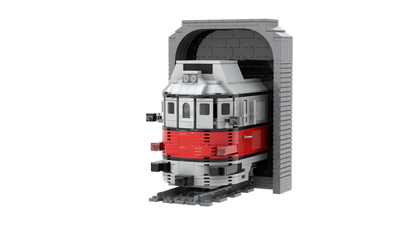 Locomotora de tren roja y blanca saliendo de un túnel gris.