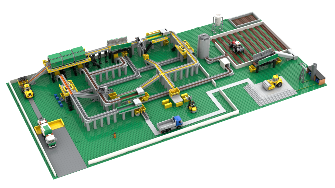 Modelo de un circuito de tren con edificios y vehículos en una base verde.