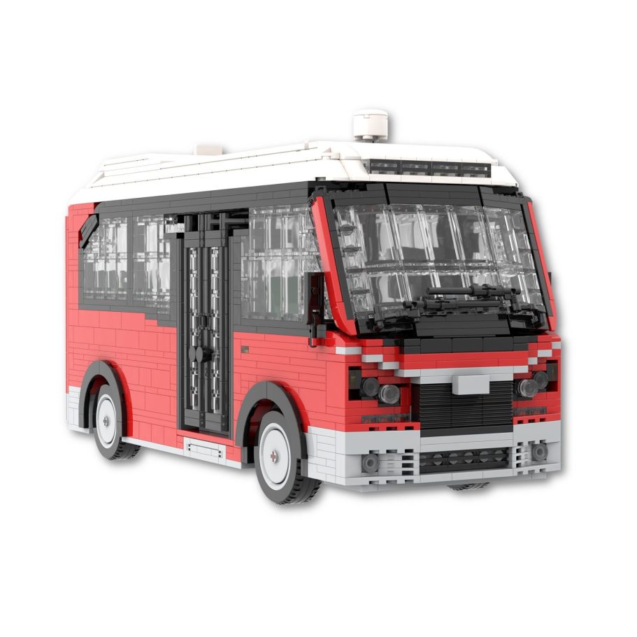 Autobús de juguete rojo y blanco hecho de bloques de construcción.