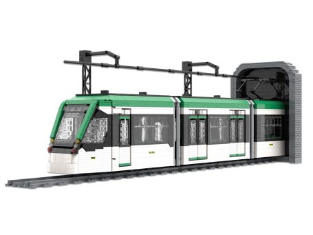 Tren de juguete CAF Urbos 3 Málaga en un túnel, con detalles en verde y blanco.